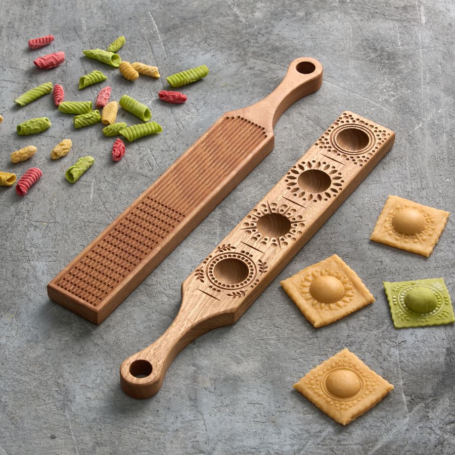 Gnocchi grooves and a ravioli mold shown with finished ravioli and colored pasta