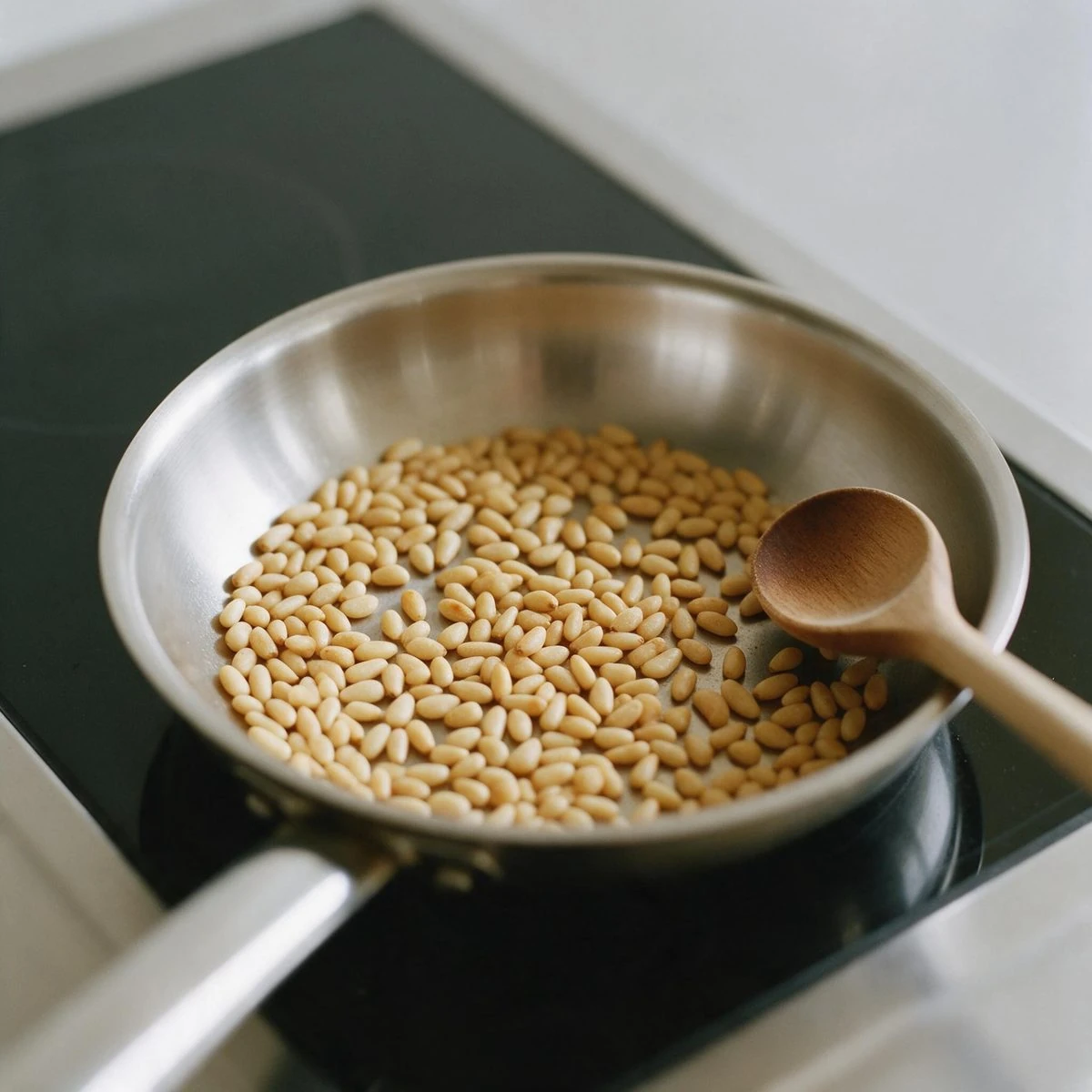 Toast the pine nuts